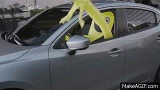car driving inflatable person
